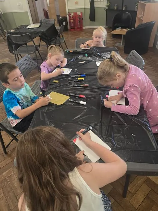Children getting creative at an arts and crafts table